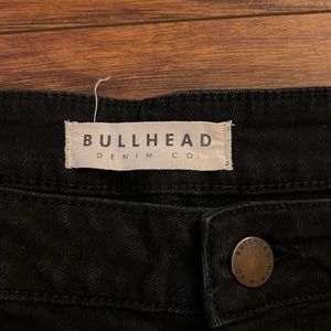 Distressed, ripped black high rise jeans